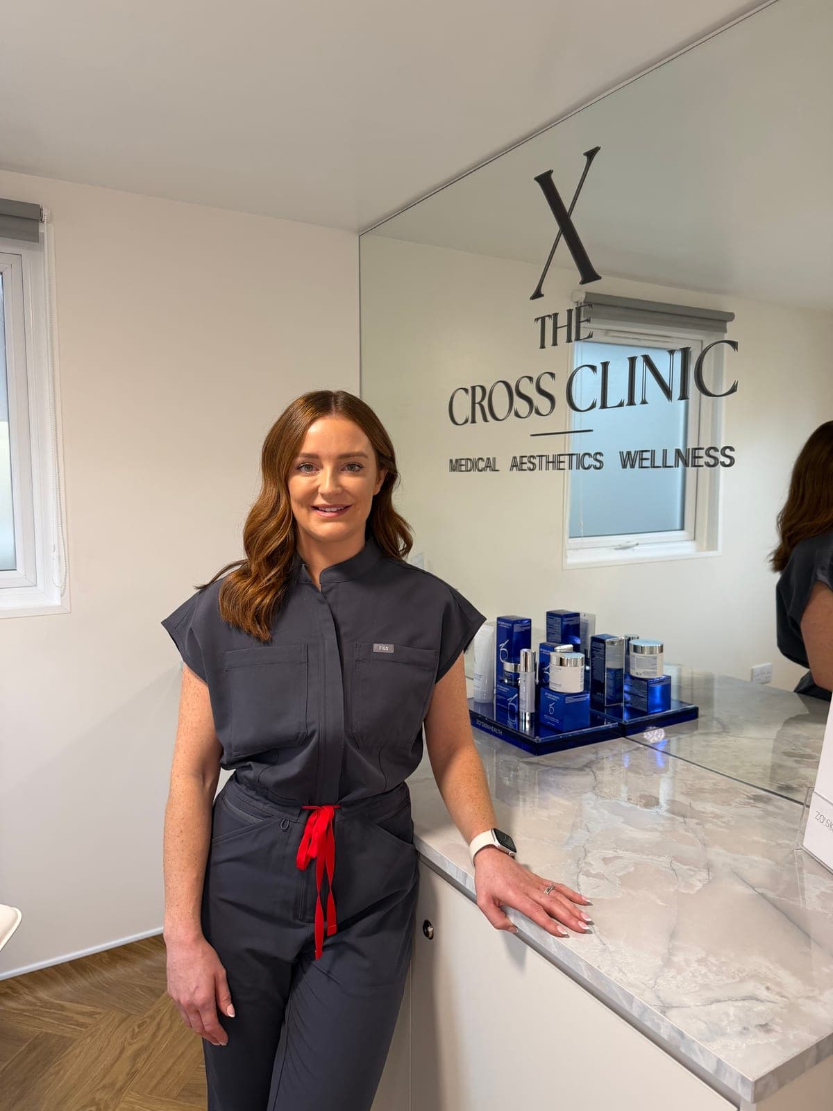 Dr Kerry Sweeney at the reception counter of The Cross Clinic
